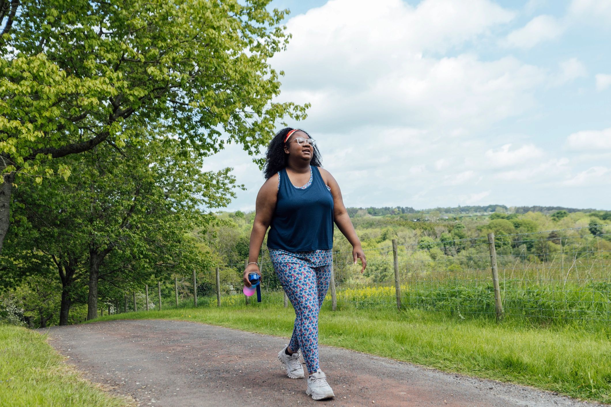 Person walking outdoors for exercise and wellbeing